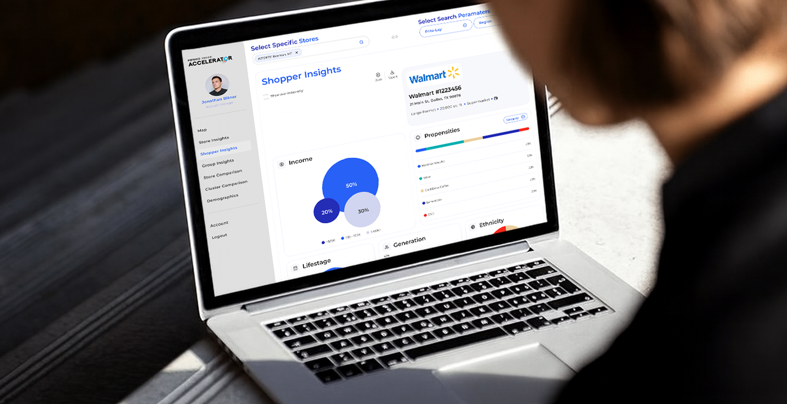Close-up of a laptop screen showing the Pepsico Demand Accelerator dashboard with data visualizations, including charts, graphs, and shopper insights.