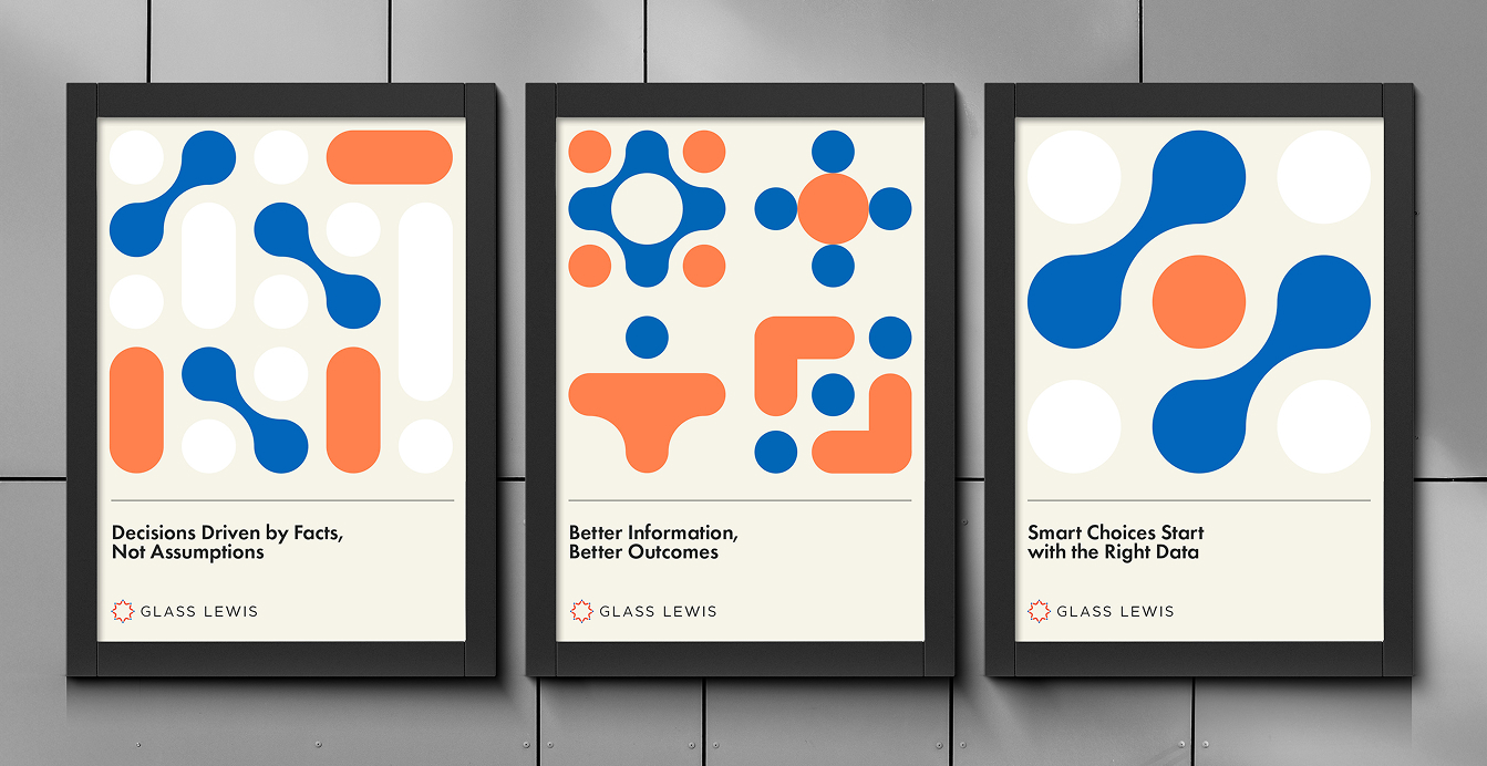 Three framed Glass Lewis posters with bold geometric patterns in blue and orange. The posters read: ‘Decisions Driven by Facts, Not Assumptions,’ ‘Better Information, Better Outcomes,’ and ‘Smart Choices Start with the Right Data.’