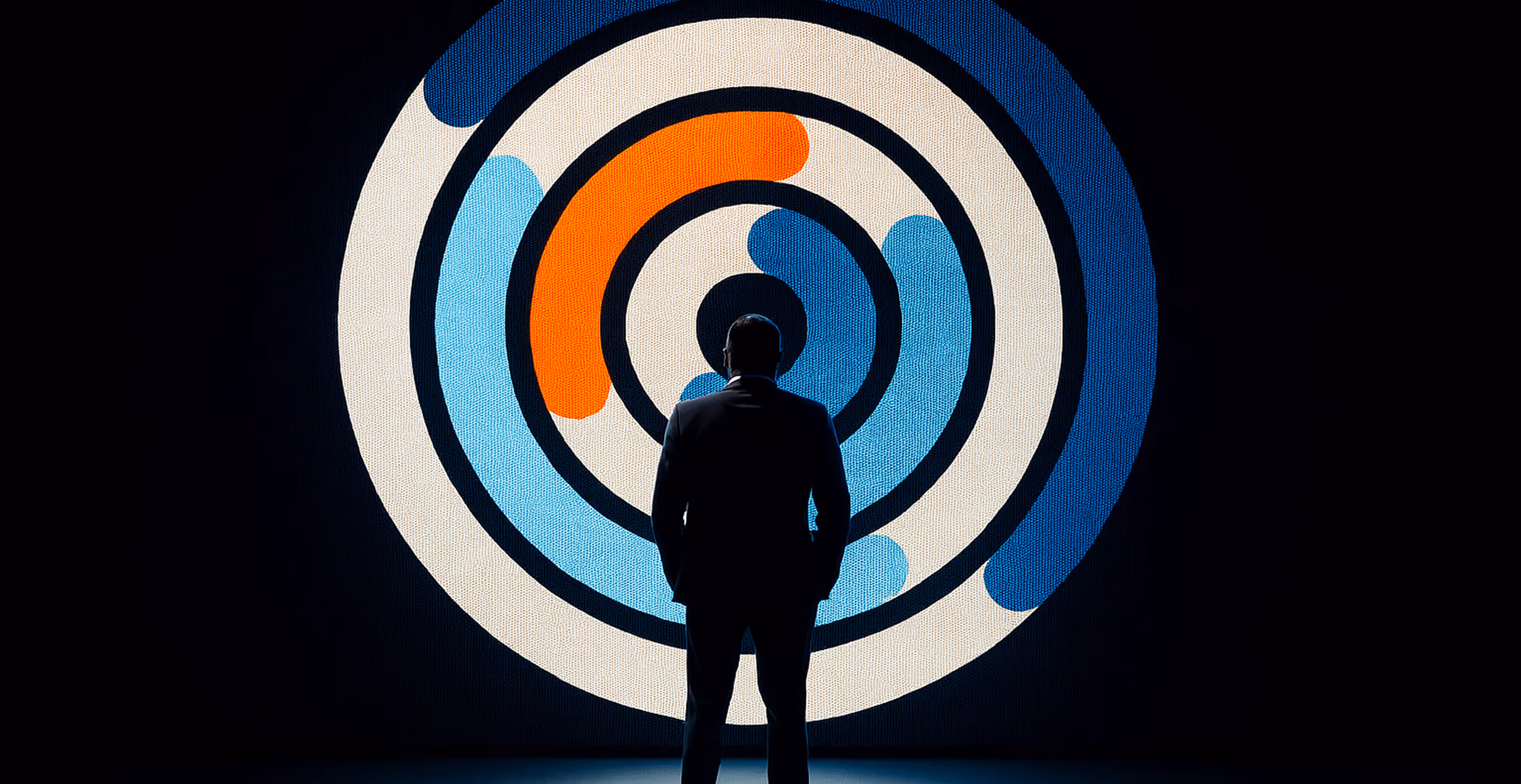 A silhouetted person in a suit stands in front of a large illuminated circular Glass Lewis graphic in blue, white, and orange rings.