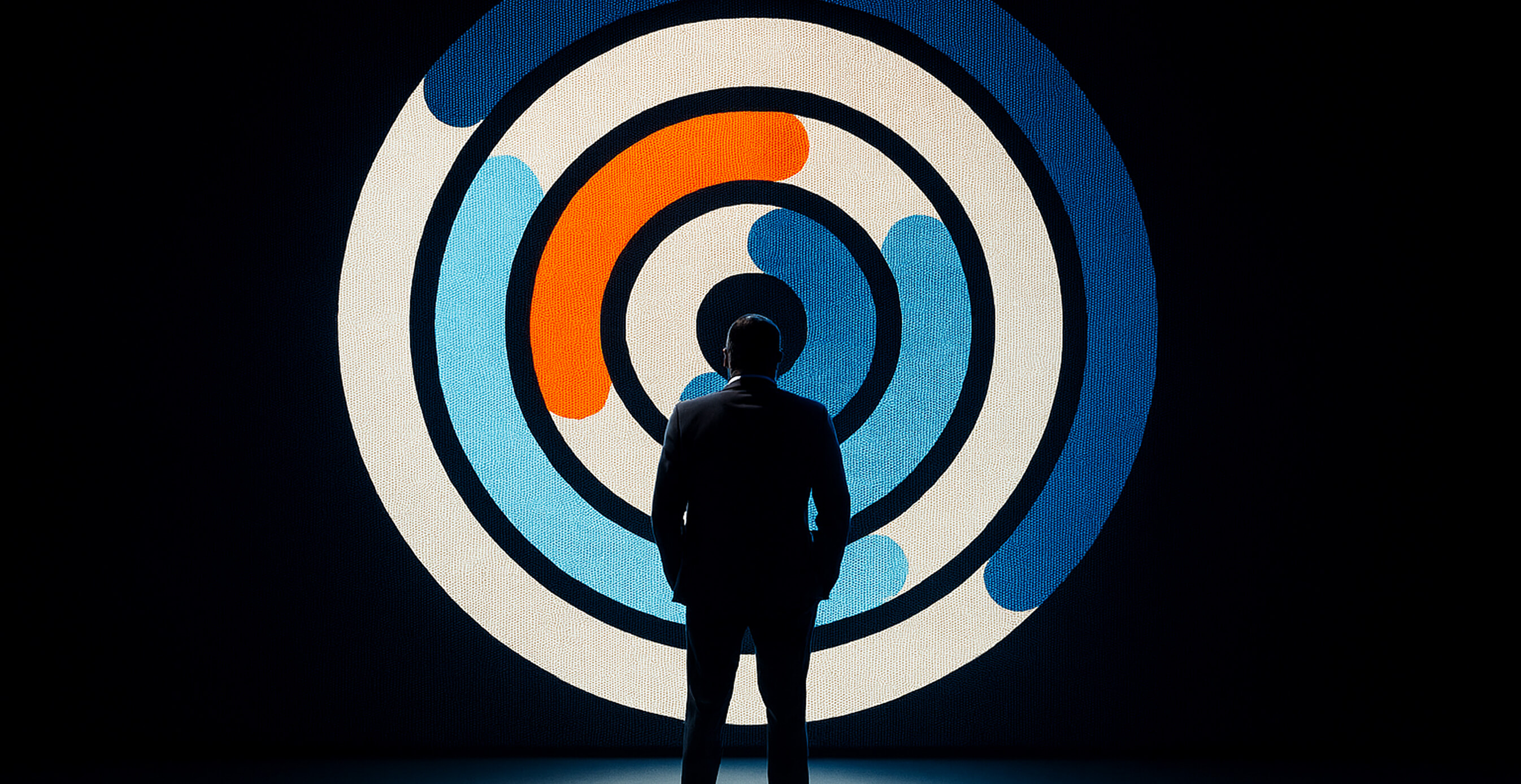 A silhouetted person in a suit stands in front of a large illuminated circular Glass Lewis graphic in blue, white, and orange rings.