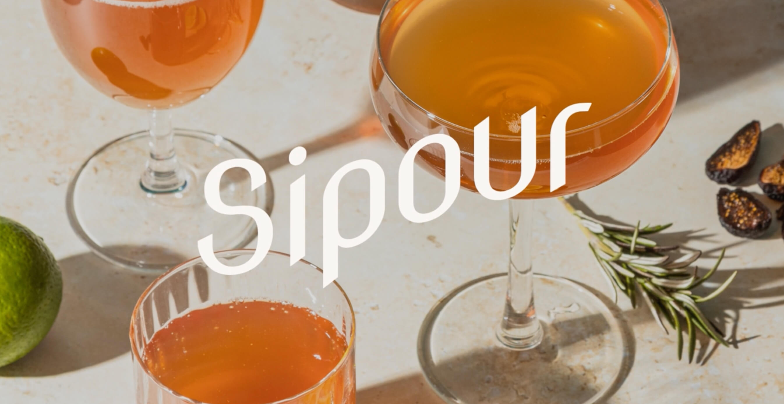 A variety of Sipour branded glassware filled with colorful cocktails, highlighting elegance and everyday magic.