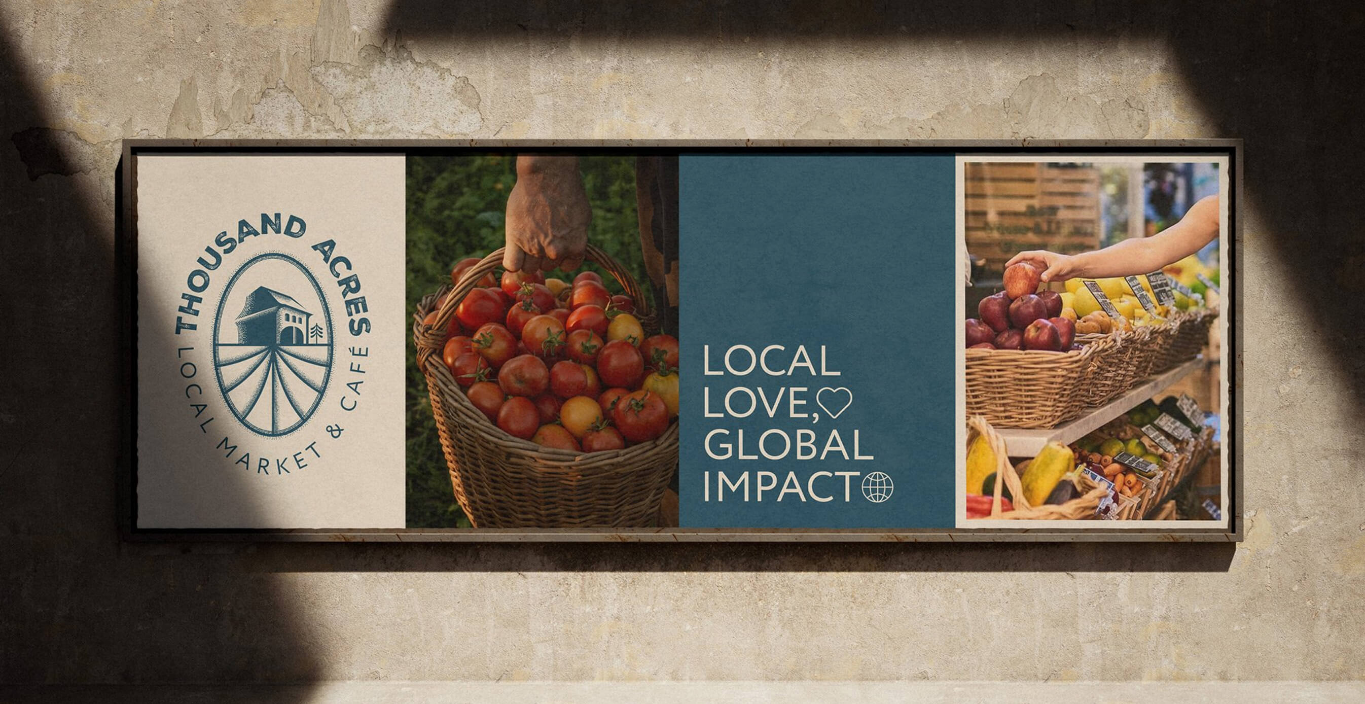 A rustic wall sign for Thousand Acres Local Market & Café featuring the logo, a basket of fresh tomatoes, and the phrase "Local Love, Global Impact."