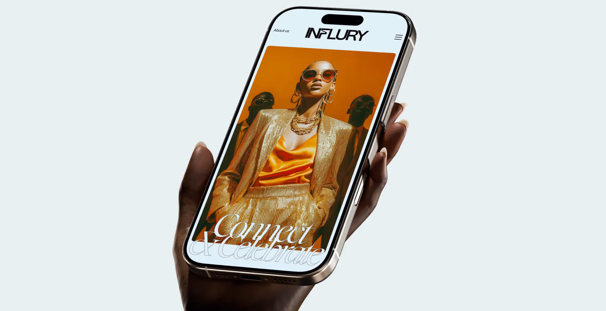 A hand holds a smartphone displaying Influry’s website, featuring a glamorous model in gold and orange attire.
