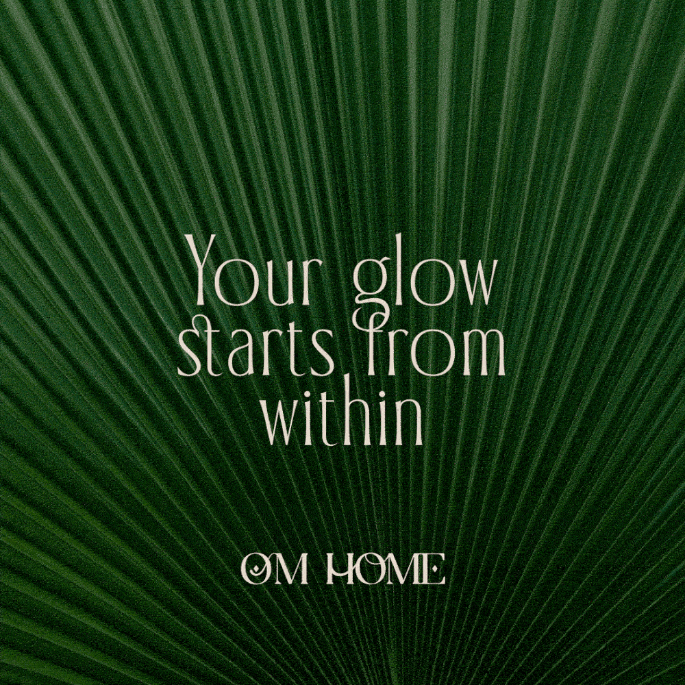 Green palm leaf background with the text 'Your glow starts from within' and OM Home logo, symbolizing natural beauty and wellness branding.