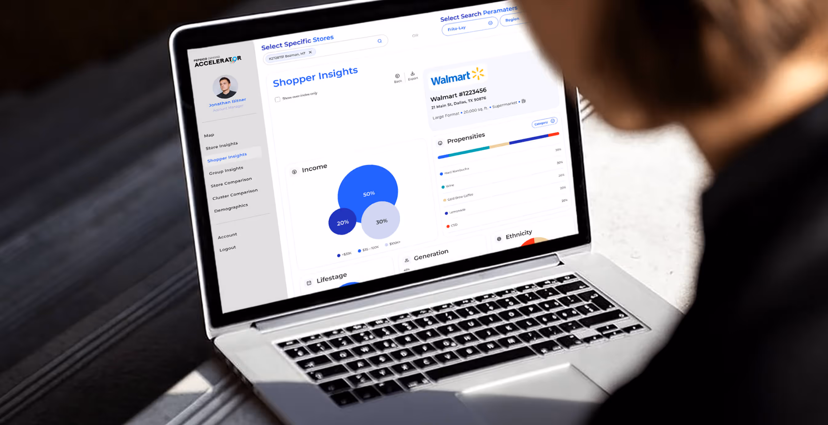 Close-up of a laptop screen showing the Pepsico Demand Accelerator dashboard with data visualizations, including charts, graphs, and shopper insights.