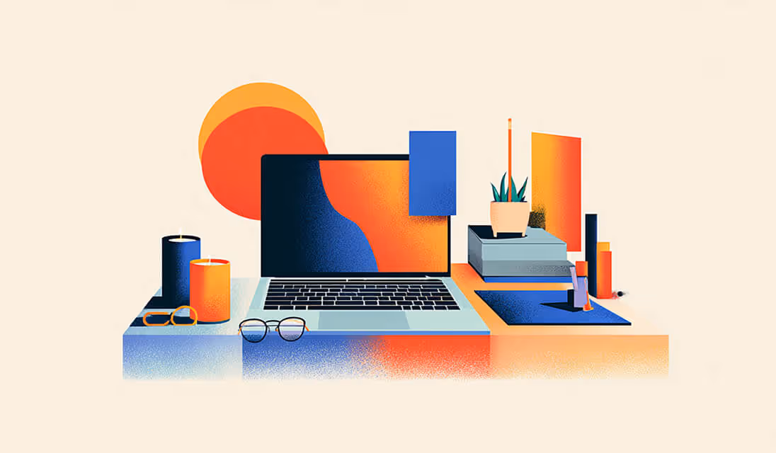 Laptop on a stylish desk surrounded by candles, glasses, and decor, symbolizing online store setup and brand aesthetic.