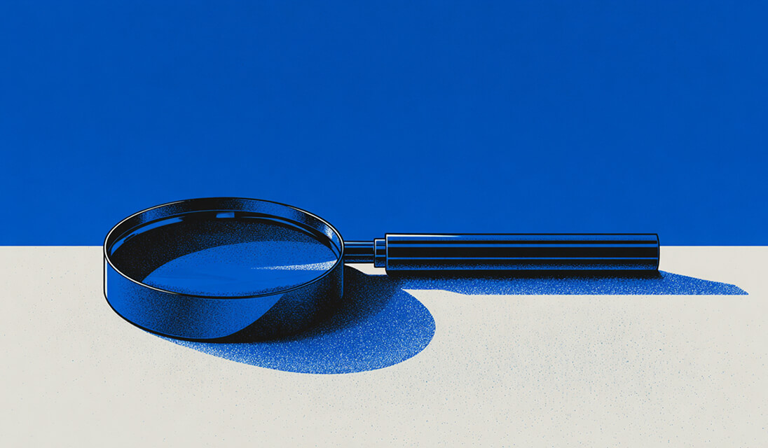 Magnifying glass on a flat surface with a blue background, representing search, analysis, and discovery.
