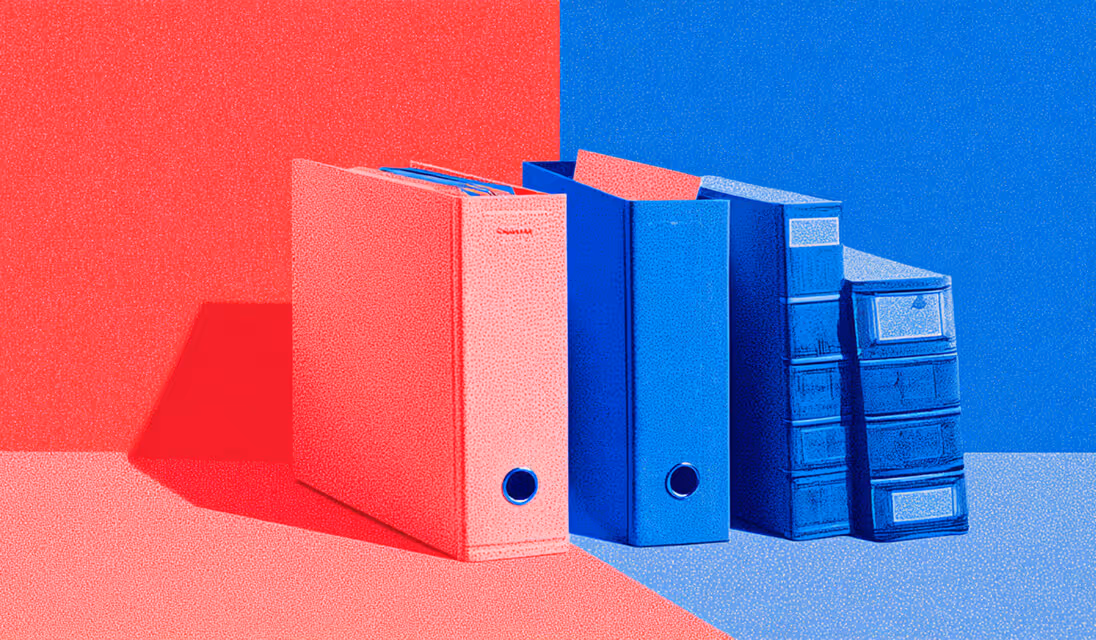 Red and blue binders arranged side by side, representing organized data management and documentation.