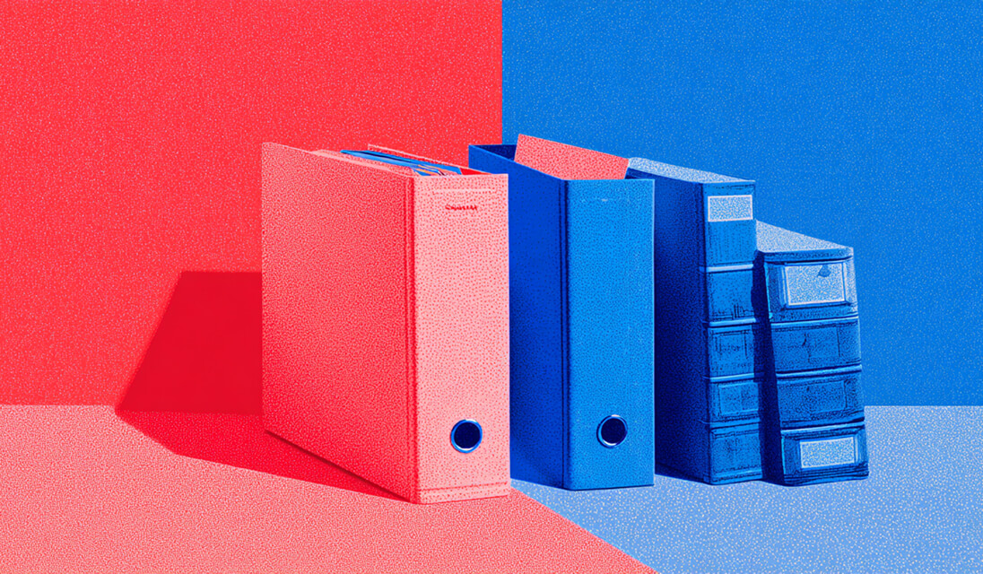 Red and blue binders arranged side by side, representing organized data management and documentation.