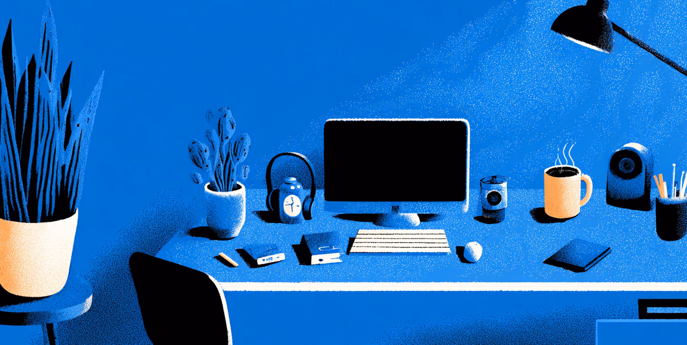 Organized modern workspace with plants, coffee, and a computer under soft lighting, representing productivity and creative focus.