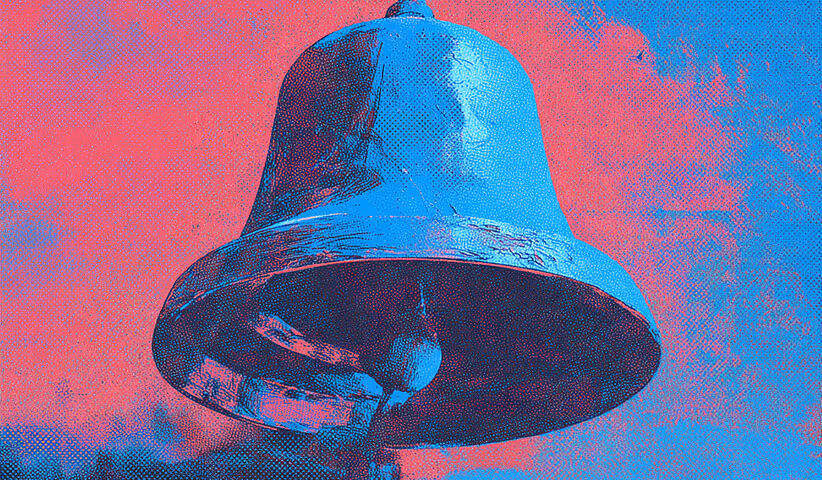 Large metallic bell against a red and blue sky, symbolizing alerts, notifications, and warnings.
