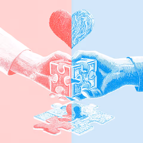 Two hands, one red and one blue, connecting puzzle pieces beneath a heart — representing collaboration, empathy, and emotional connection in advertising.