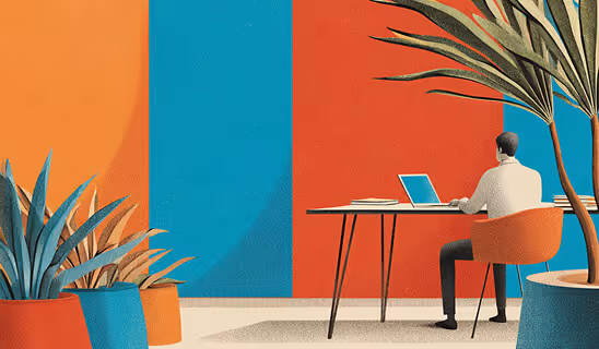 A man working on a laptop in a modern workspace surrounded by large plants and bold red and teal wall panels.