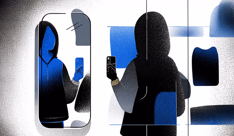 Person taking a photo of themselves reflected in a smartphone screen, illustrating real customers creating authentic UGC.