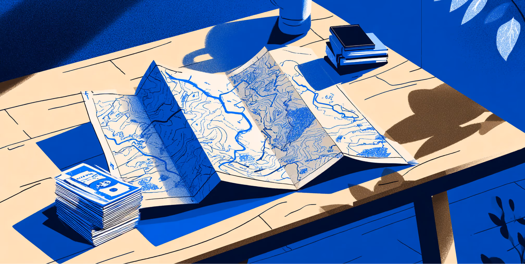 Illustration of a folded map spread across a wooden desk with stacks of money and books nearby, symbolizing financial planning, research, and strategic direction.