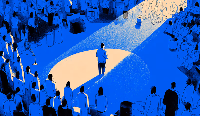 A speaker standing in a spotlight addressing a surrounding audience, symbolizing leadership, vision alignment, and strategic communication.