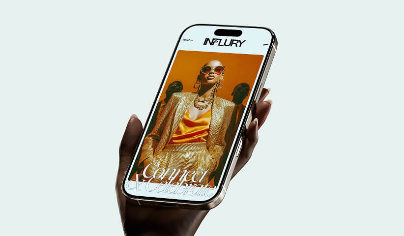 Smartphone displaying the INFLURY fashion website with luxury imagery and modern typography, highlighting mobile brand experience design.