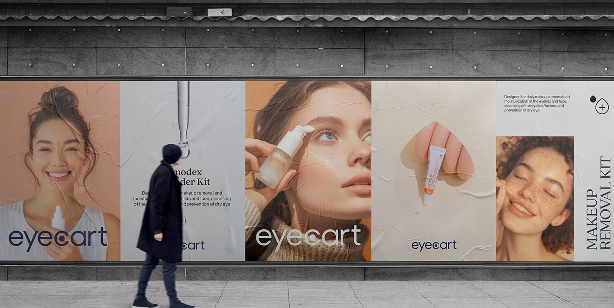 Large Eyecart billboard advertisement featuring skincare product visuals and a pedestrian walking past.