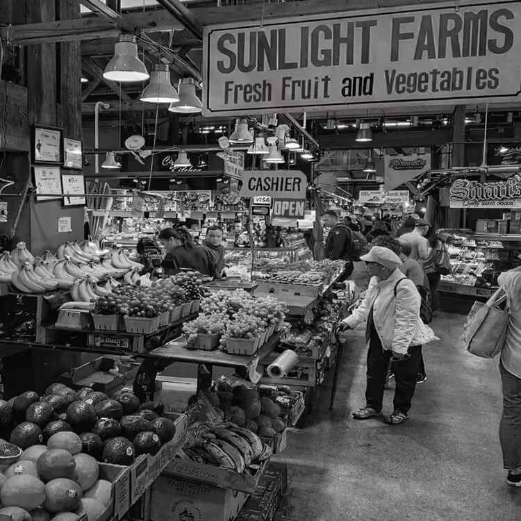 Granville Island Public Market interior featuring fresh produce stands and local vendors in Vancouver, BC.