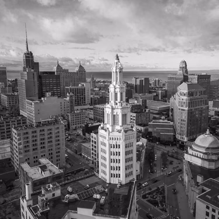 Aerial view of downtown Buffalo skyline highlighting Art Deco architecture and city landmarks near Lake Erie.