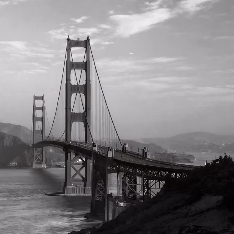 Golden Gate Bridge spanning San Francisco Bay with coastal hills in California.