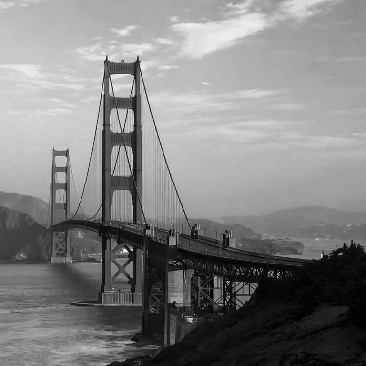 Golden Gate Bridge spanning San Francisco Bay with coastal hills in California.