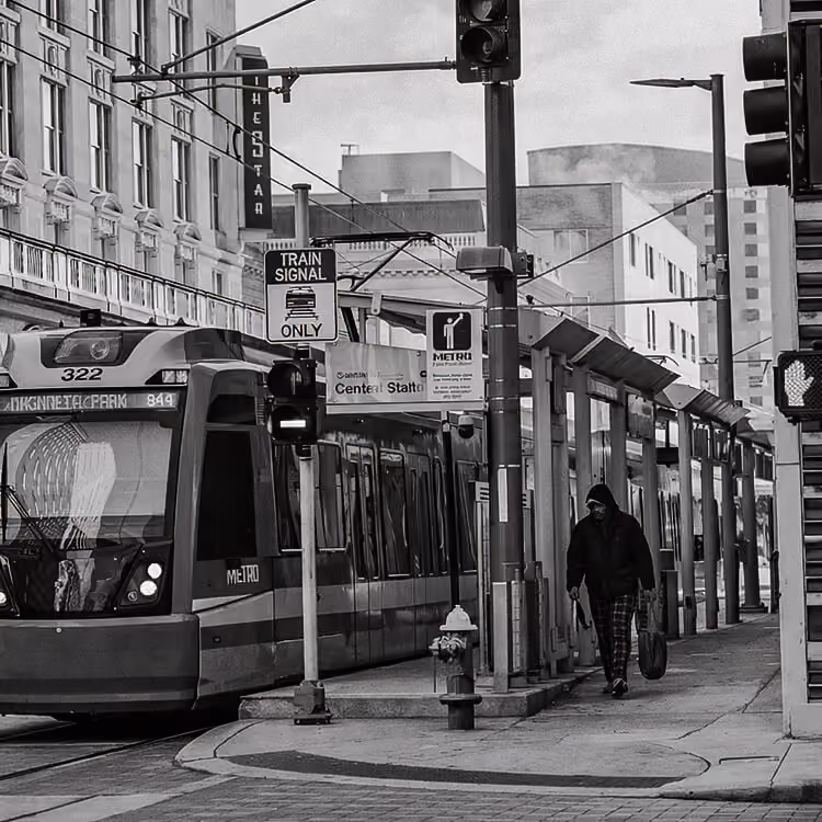 Houston METRORail train arriving at a downtown light rail station in Texas.