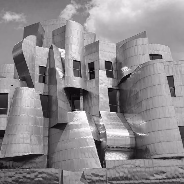 Black and white close-up of the Weisman Art Museum’s curved stainless steel architecture on the University of Minnesota campus.