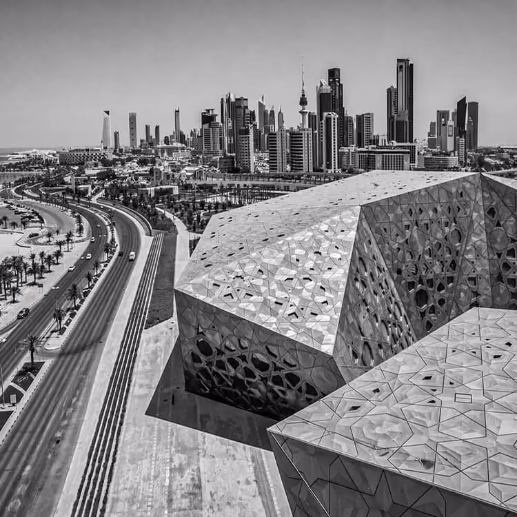 Black and white view of the Sheikh Jaber Al-Ahmad Cultural Centre with geometric architecture in Kuwait City.