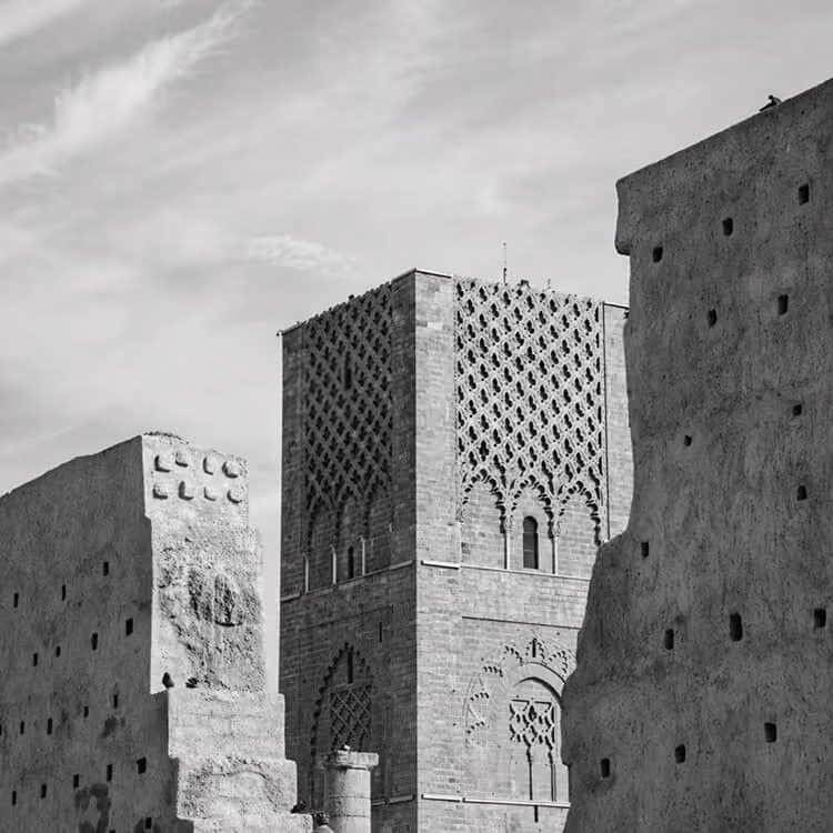 Black and white view of Bahrain Fort with historic stone architecture and traditional design details.