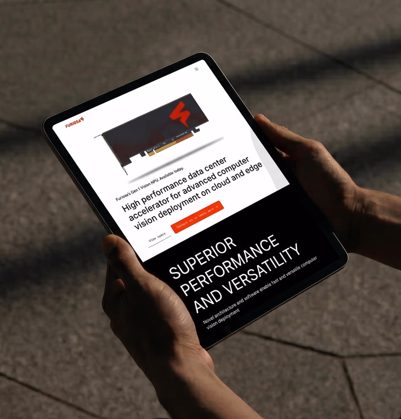 Person holding a tablet showing the Furiosa product page for a high-performance data center accelerator with cloud and edge deployment.