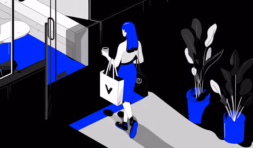 Person walking with shopping bags in a branded retail space, representing how logos influence consumer experience.
