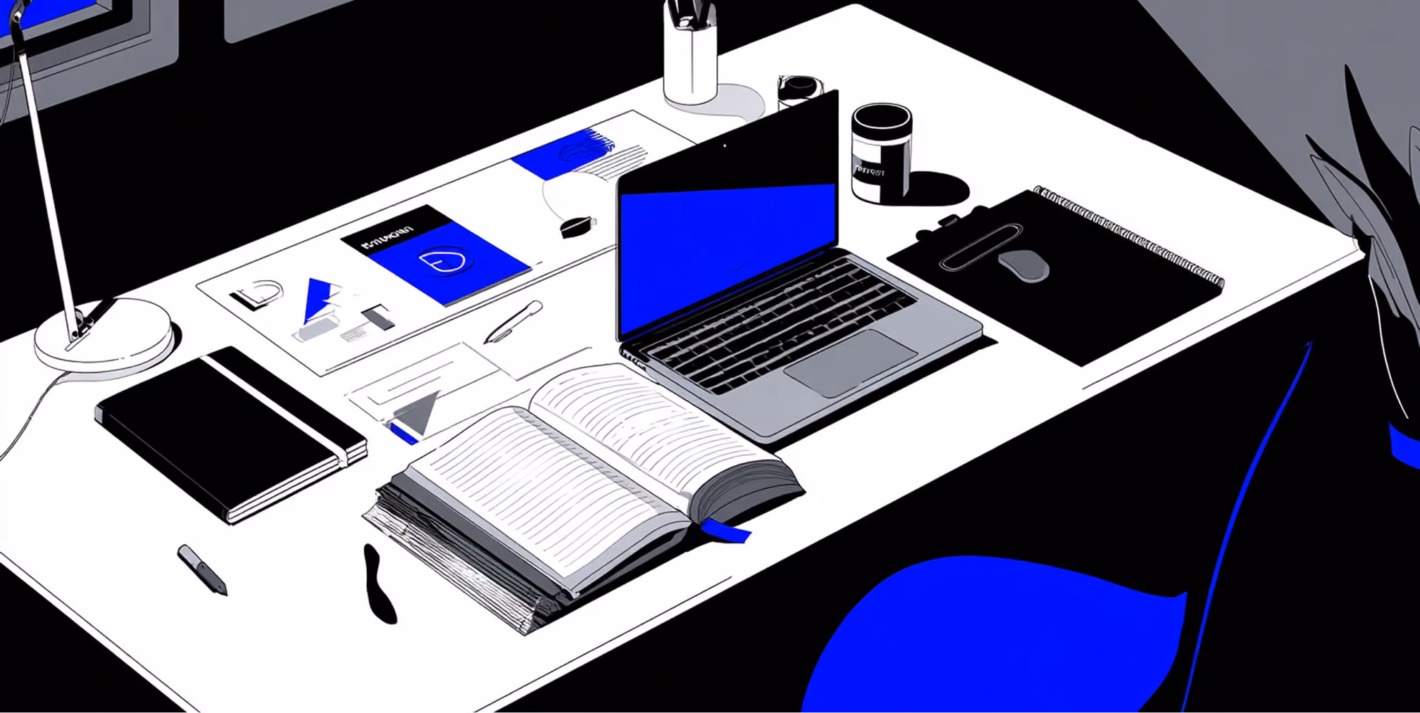 Workspace with laptop, sketchbook, and branding materials, representing the creative process behind logo design.