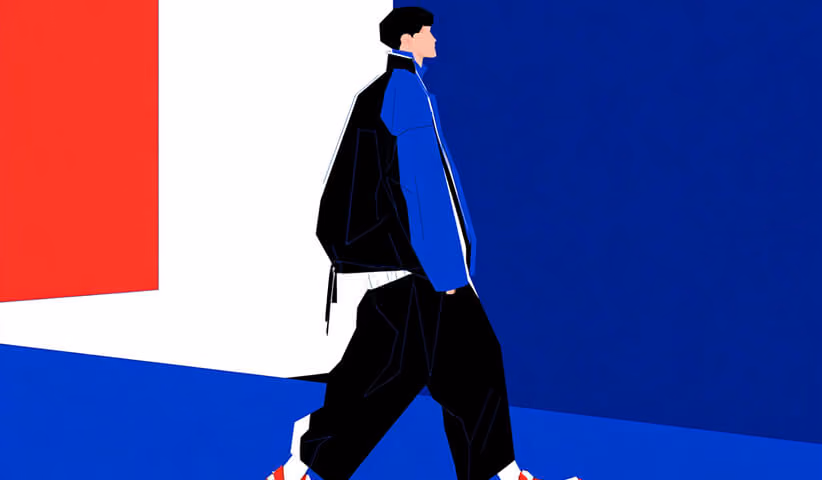 Person walking in a modern streetwear outfit, highlighting silhouette, layering, and movement in urban fashion.