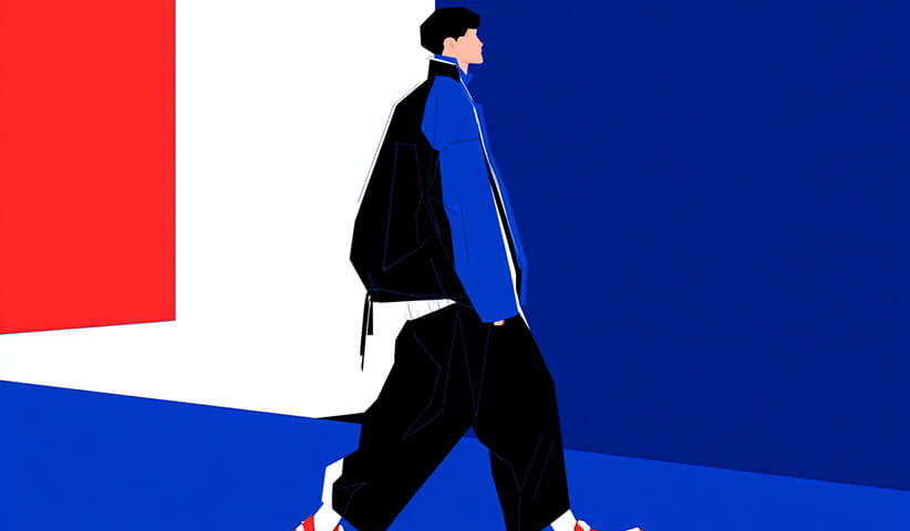 Person walking in a modern streetwear outfit, highlighting silhouette, layering, and movement in urban fashion.