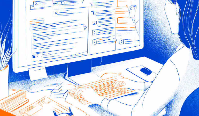 Person working at a computer with structured content on screen, representing content optimization and on-page SEO.