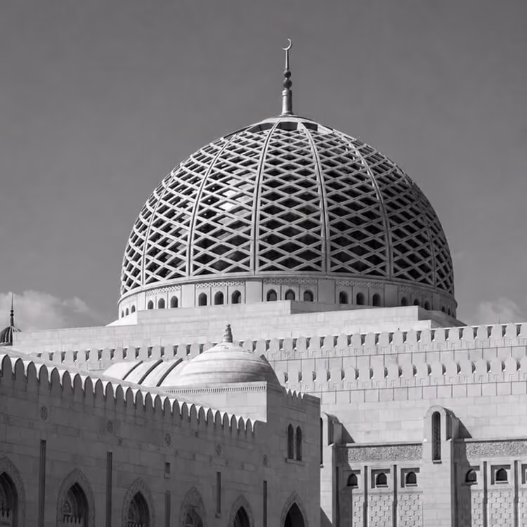 Close-up of mosque dome in Muscat featuring intricate geometric patterns and Islamic architecture.