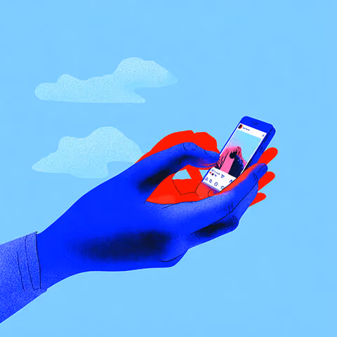 Hand using a smartphone to post content, representing real-time social sharing and interaction.