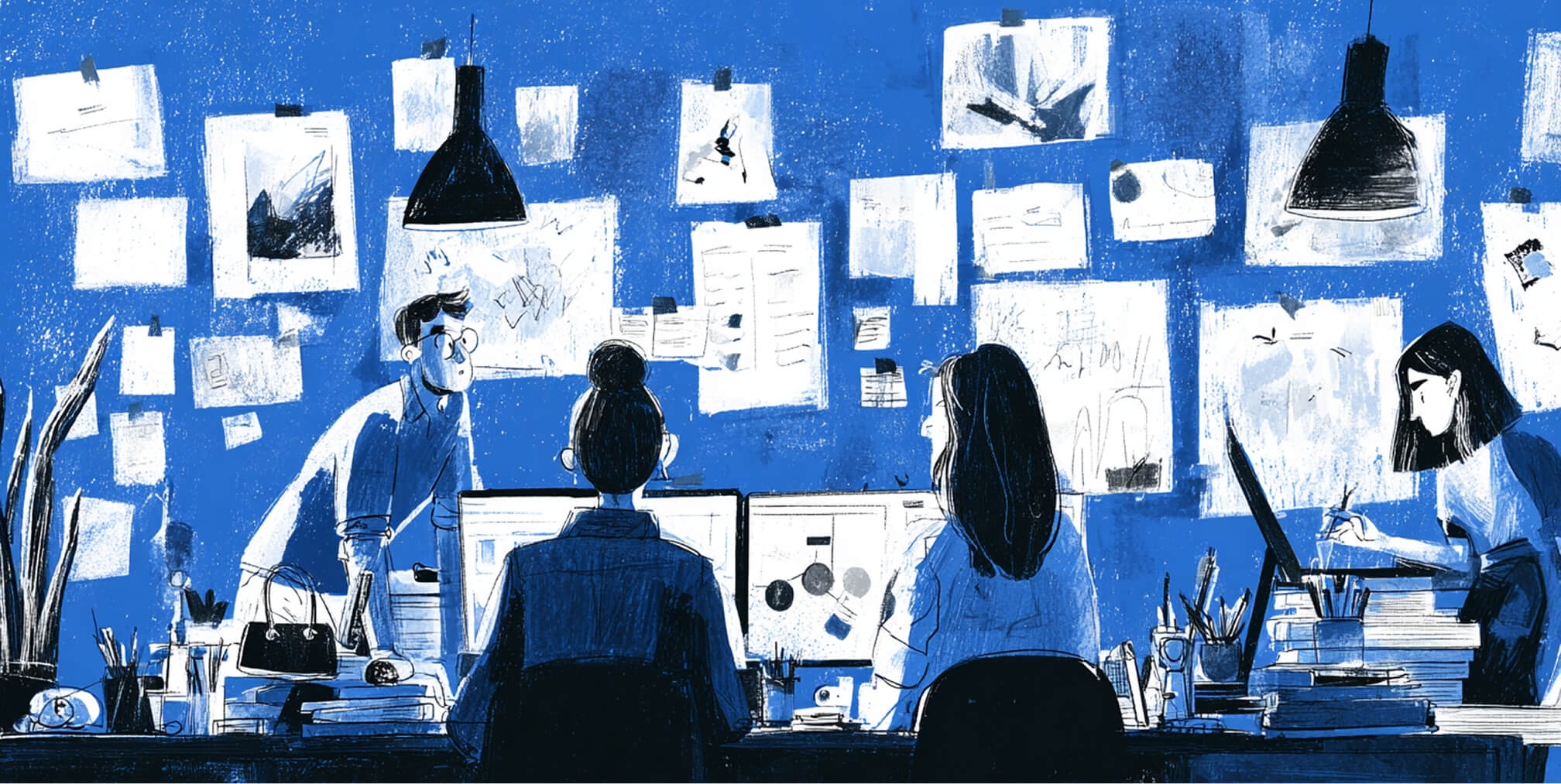 Creative team working together in a studio with walls covered in sketches and notes, representing collaboration and full-service branding execution.