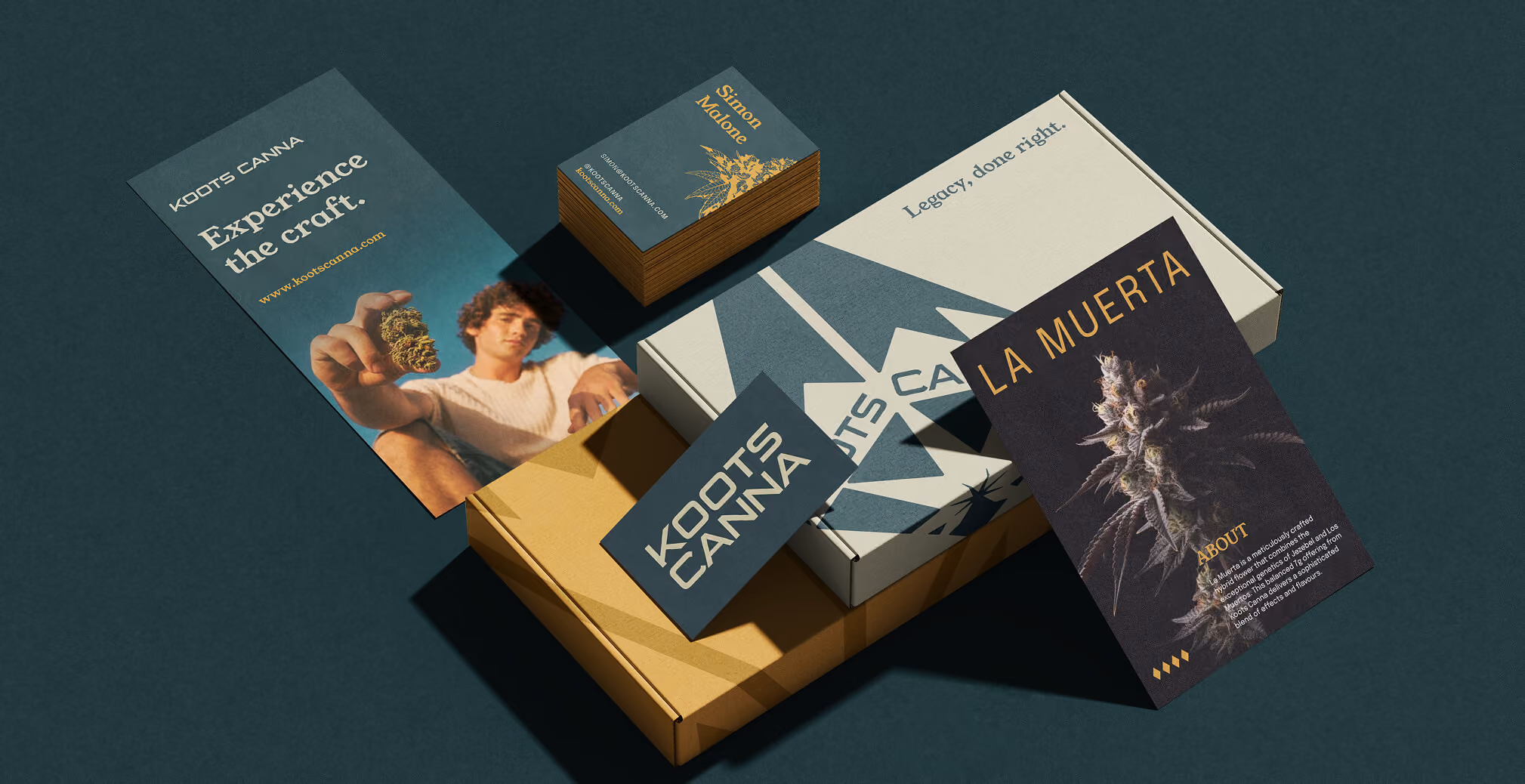 Branded Koots Canna packaging system featuring product boxes, business cards, promotional flyers, and cannabis strain marketing materials arranged on a dark teal surface.