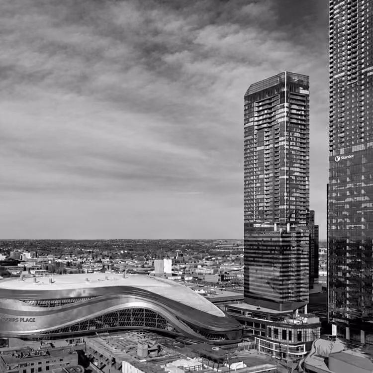 Downtown Edmonton skyline featuring modern high-rise towers and Rogers Place arena architecture.