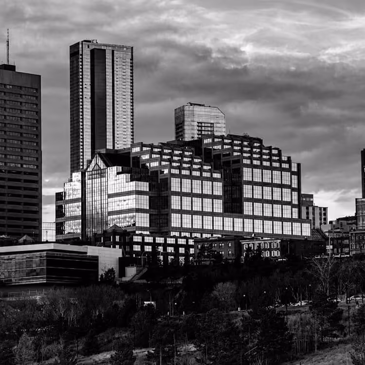 Modern office towers and commercial buildings rising above Edmonton’s urban landscape.