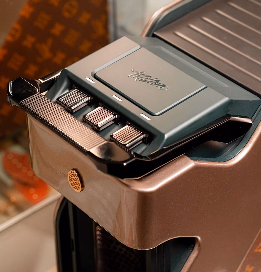 Close-up of the Milton Coffee machine's premium control panel and metallic finish, emphasizing precision engineering and luxury product craftsmanship.