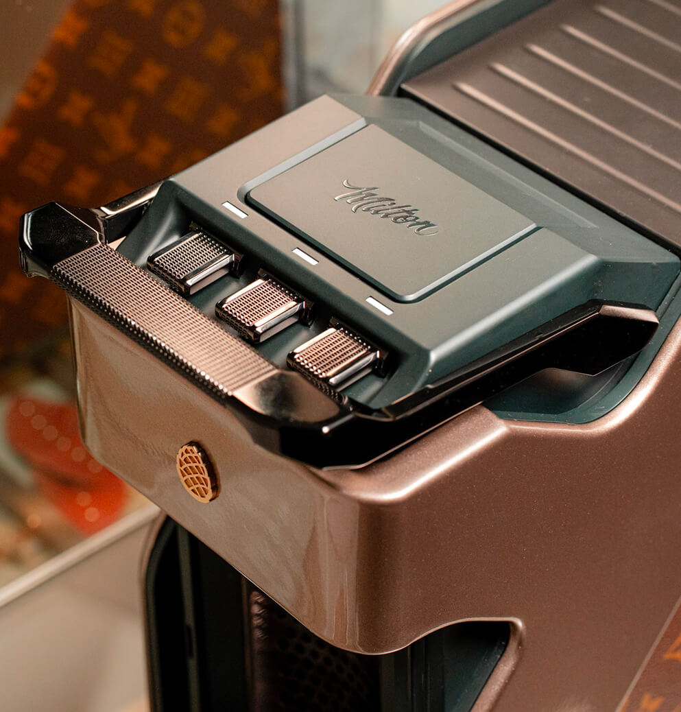 Close-up of the Milton Coffee machine's premium control panel and metallic finish, emphasizing precision engineering and luxury product craftsmanship.