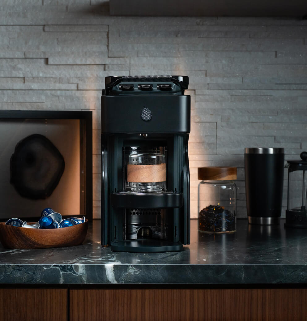 Modern Milton Coffee machine displayed in a contemporary kitchen environment with coffee accessories, demonstrating premium hospitality and home coffee solutions.