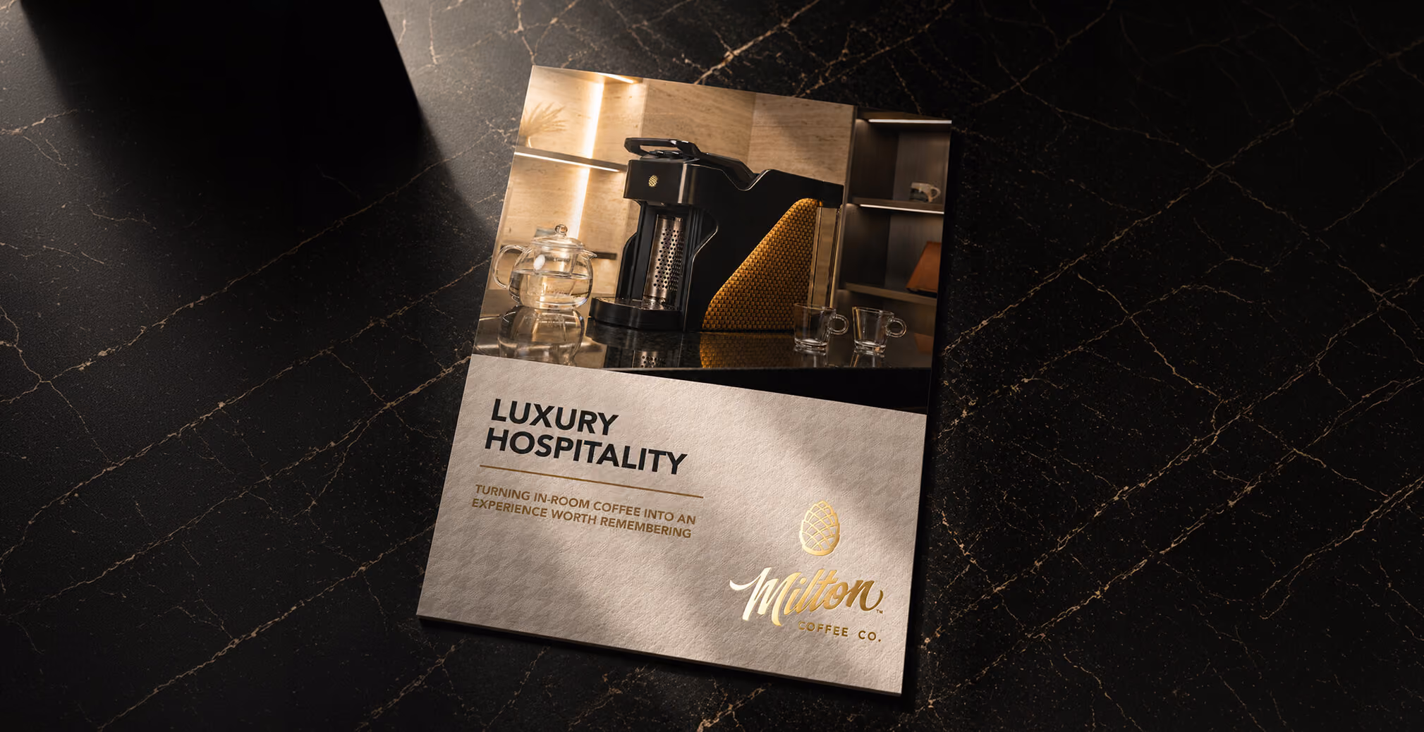 Luxury hospitality brochure featuring Milton Coffee branding, premium product photography, and elegant print design on a marble surface.