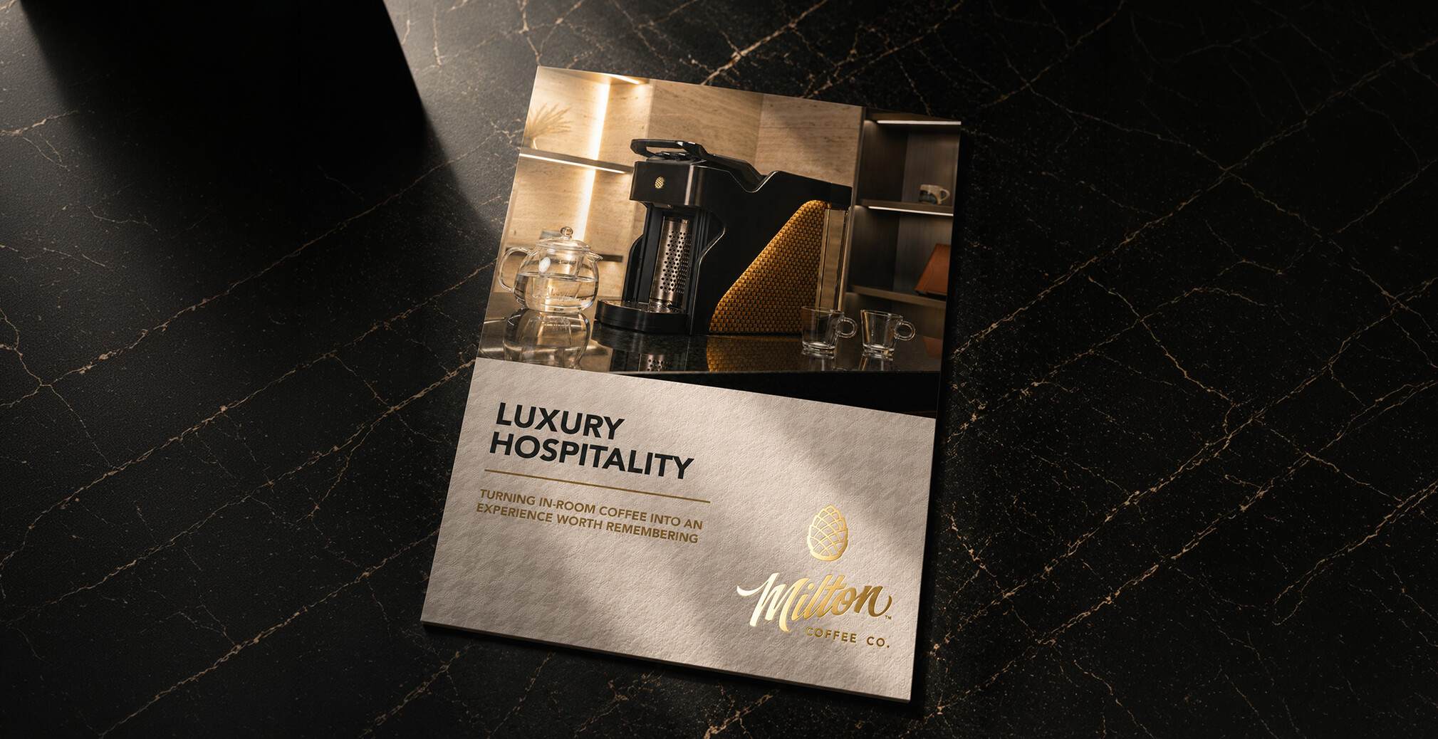 Luxury hospitality brochure featuring Milton Coffee branding, premium product photography, and elegant print design on a marble surface.