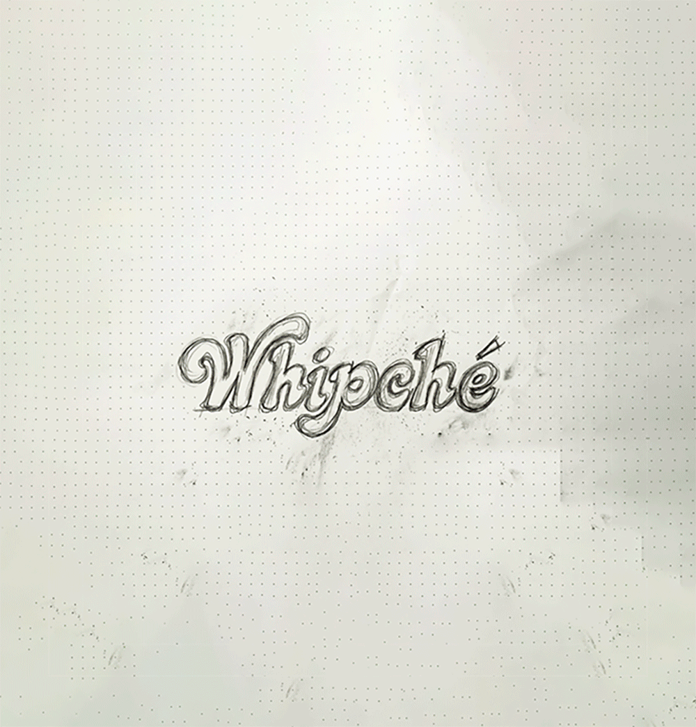 arly Whipché logo sketch shown on a textured design board, illustrating the brand identity development and hand-drawn logo creation process.