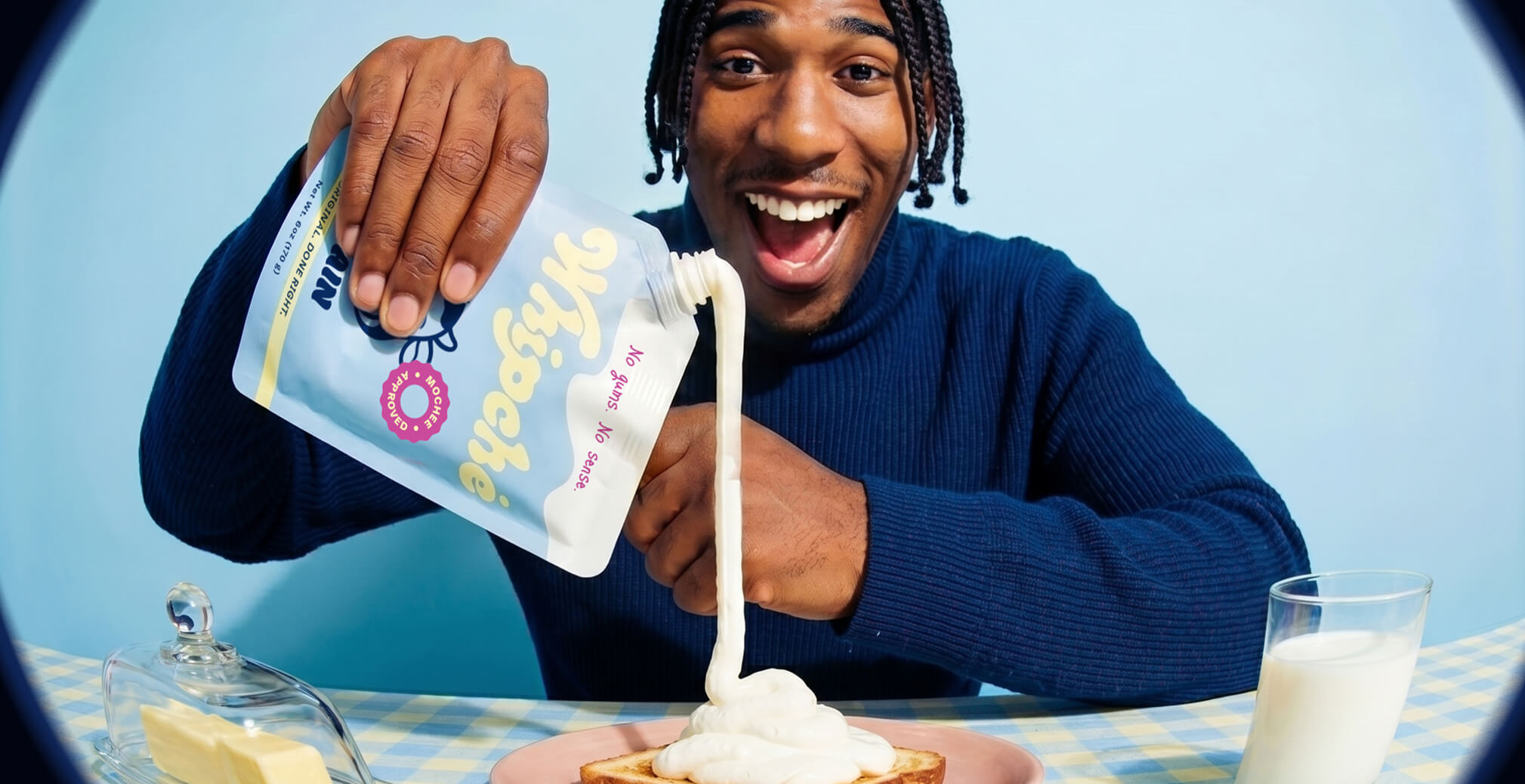 Person pouring Whipché cream cheese from a pouch onto toast, highlighting the product’s unique format, convenience, and playful brand personality.
