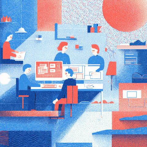 Team collaborating around computer screens in a modern workspace, illustrating the design and development process behind website creation.